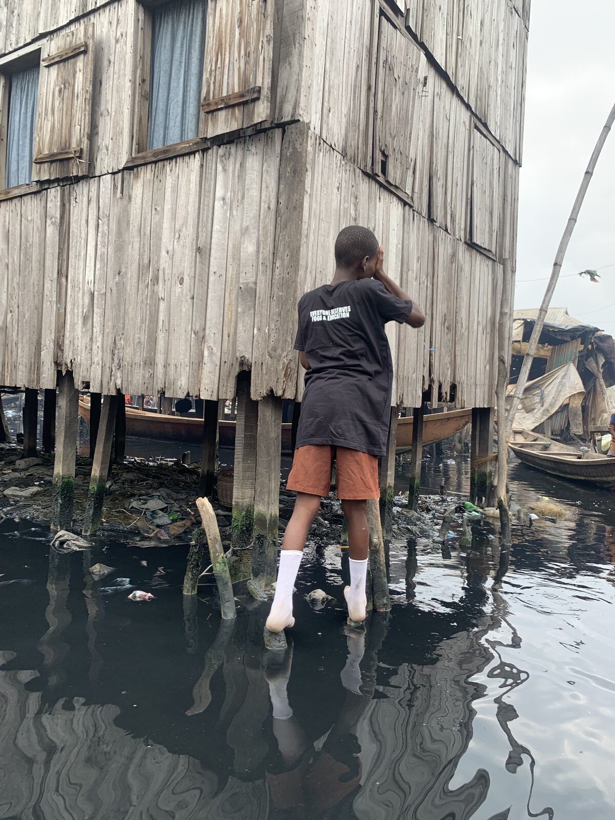 Raised above the lagoon. Families live in wooden homes on stilts, reached only by water.