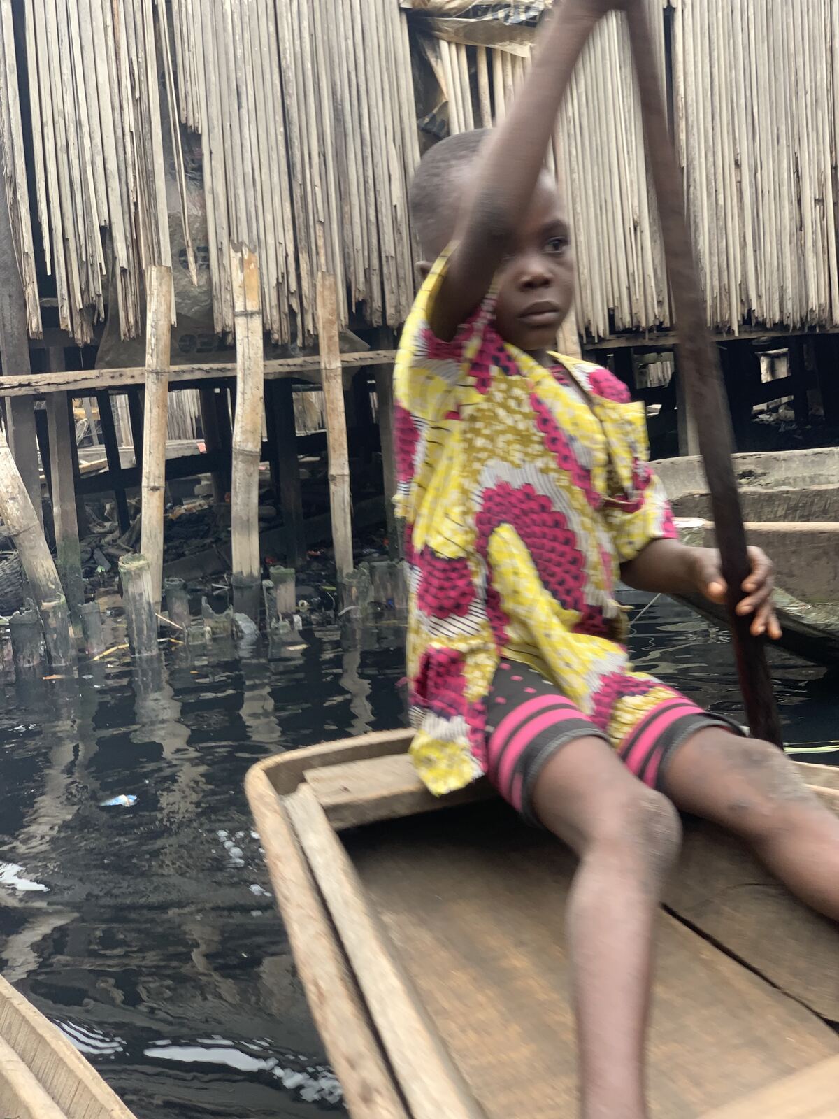 Home is on the water. Makoko is built on stilts over the Lagos Lagoon. Children paddle to school, to market, and home.
