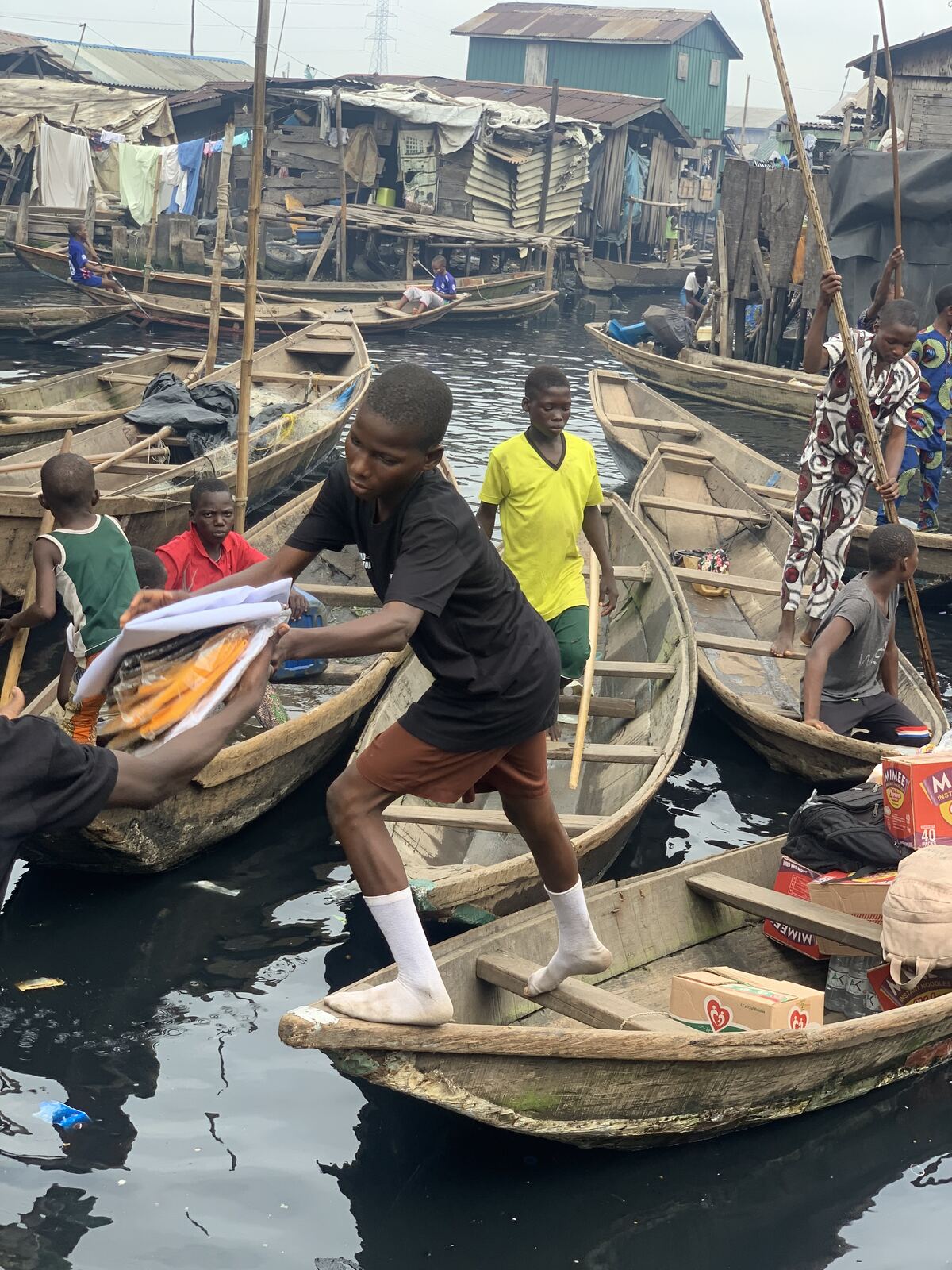 Food, delivered by canoe. Volunteers carried food parcels from boat to boat so no family had to come to us.